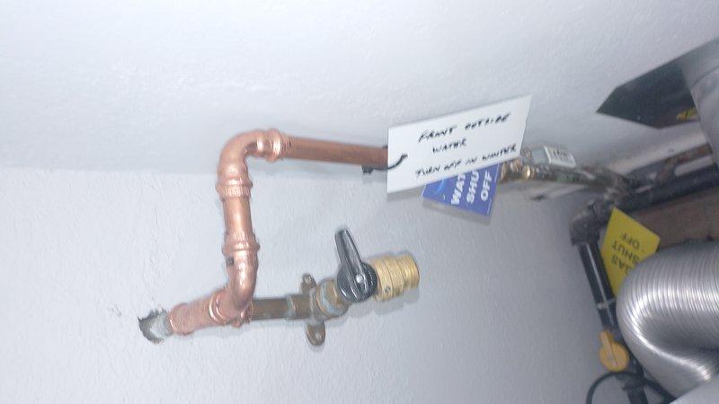 Responded to callback for leaking exterior hose bibb that was triggering water alarm system hourly. Upon inspection, discovered the outdoor spigot installation had failed due to severely corroded supply piping. Removed deteriorated metal pipes showing extensive mineral buildup and oxidation. Replaced compromised section with new copper piping and properly secured connections with shutoff valve. Tested system for leaks and verified alarm system reset. Installation now functioning properly without water intrusion.
