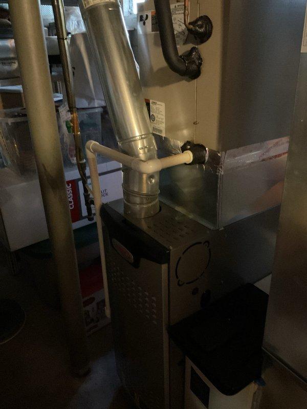 Completed comprehensive HVAC system assessment for air conditioning replacement estimate in residential basement installation. Documented existing furnace unit, ductwork configuration including metallic supply ducts and flexible return connections, and evaluated current equipment condition to provide accurate replacement specifications for new AC system integration with existing heating infrastructure.