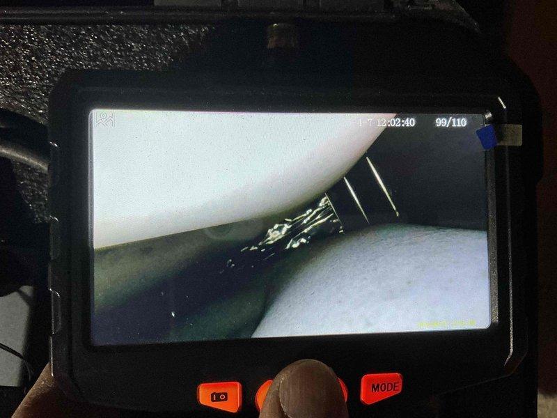 Responded to callback for furnace not producing warm air. Performed video inspection of ductwork and interior components using borescope camera to identify airflow restrictions or disconnected ducts. Documented findings with timestamped inspection footage showing interior duct conditions and potential obstruction points.