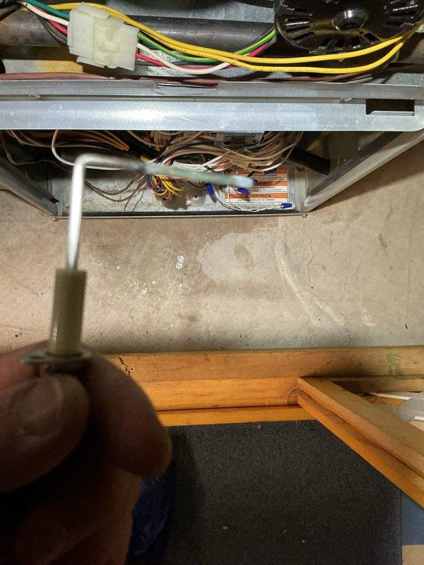 Completed scheduled heating maintenance inspection on residential gas furnace system. Performed thorough visual examination of burner assembly, noting moderate corrosion and rust accumulation on burner ports and manifold, documented condition with photographs for service records. Inspected electrical connections, blower motor assembly, and internal wiring, confirming all components operational and system functioning properly.