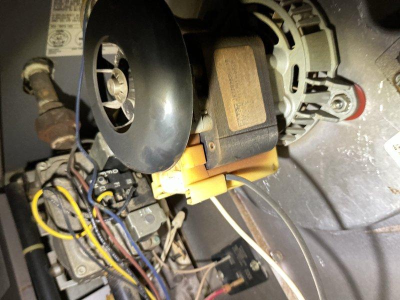 Responded to no heat call where system was blowing cold air. Upon inspection, accessed blower assembly and verified all electrical connections, motor operation, and drive belt condition. Documented equipment condition with photos of return air grille and internal blower motor components including capacitor, wiring harness, and motor assembly for service records.