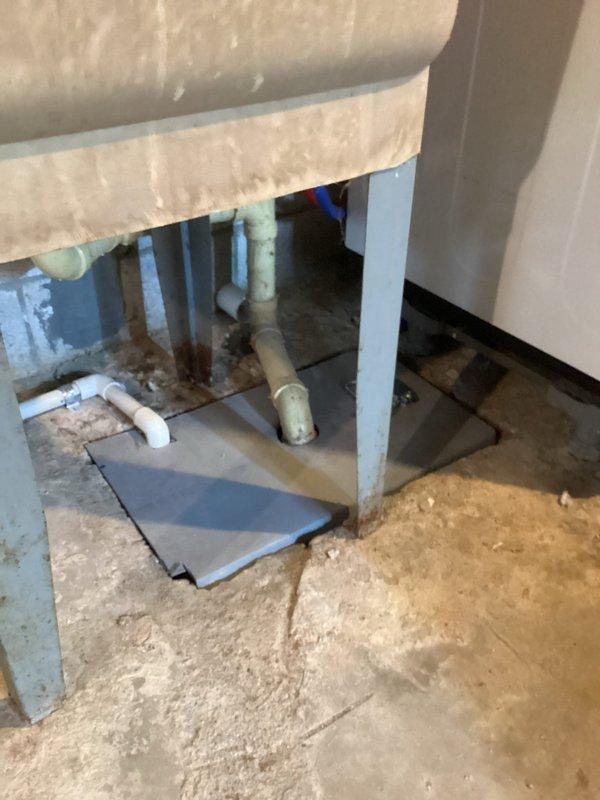 Returned to property to address installer damage from previous HVAC installation. Replaced cracked sewer cover in basement that was broken during initial equipment installation. Verified proper fit and seal of new cover, confirmed no drainage issues, and cleaned work area of debris.