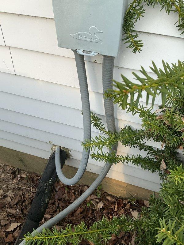 Completed routine cooling maintenance inspection on residential HVAC system. Verified proper operation of outdoor condensing unit, confirmed electrical disconnect box functionality and secure conduit connections, and documented equipment condition with photographs showing all components in serviceable condition with normal wear patterns.