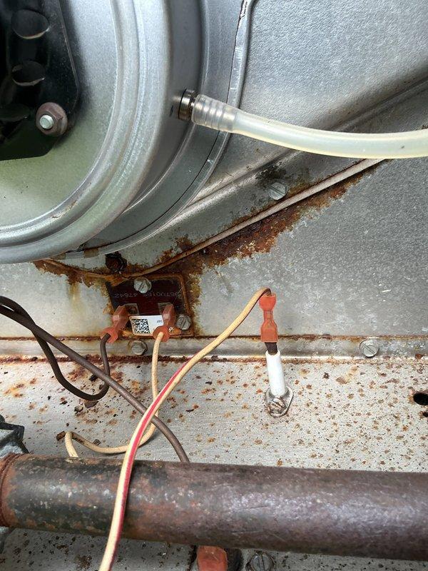 Completed comprehensive tune-up on outdoor combi unit. Performed standard maintenance procedures including inspection of all internal components, burner assembly, heat exchanger, and refrigeration lines. Noted significant rust staining and corrosion throughout equipment cabinet, particularly on base pan and mounting surfaces, indicating prolonged moisture exposure. Inspected electrical connections, sensors, and control wiring; all functional despite visible weathering on exterior components. Checked condensate drainage system and tubing connections. Unit operational upon completion; customer renewed maintenance plan agreement.