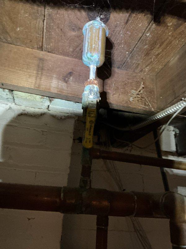 Completed scheduled boiler maintenance inspection responding to early morning service call. Performed comprehensive system evaluation including examination of copper supply piping, brass valve assemblies, and associated plumbing connections. Documented existing corrosion and mineral buildup on vertical valve assembly and oxidation present on horizontal copper piping throughout the mechanical space. All findings photographed for service records and system maintained according to manufacturer specifications.