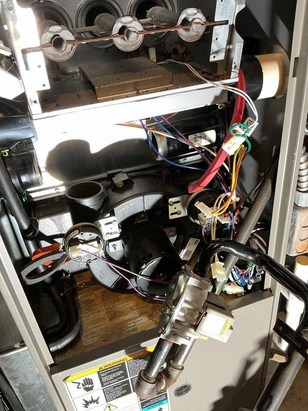 Responded to service call for 10-year-old Lennox gas furnace with reported inducer motor failure. Upon arrival, performed diagnostic evaluation of heating system and confirmed inducer motor assembly was inoperative and required replacement. Removed access panels and disconnected electrical connections to failed inducer motor. Removed defective inducer motor assembly from furnace cabinet. Installed new OEM inducer motor assembly, ensuring proper mounting and alignment with pressure switch tubing and exhaust system. Reconnected all electrical connections and verified proper wire routing. Tested pressure switches for proper operation and verified draft inducer performance. Cycled furnace through complete heating sequence to confirm proper ignition, burner operation, and heat exchanger functionality. Verified all safety controls operating within manufacturer specifications. Reinstalled access panels and left unit operational.