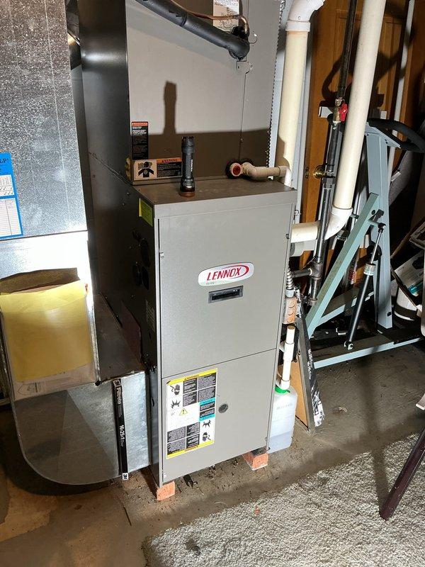 Responded to service call for 10-year-old Lennox gas furnace with reported inducer motor failure. Upon arrival, performed diagnostic evaluation of heating system and confirmed inducer motor assembly was inoperative and required replacement. Removed access panels and disconnected electrical connections to failed inducer motor. Removed defective inducer motor assembly from furnace cabinet. Installed new OEM inducer motor assembly, ensuring proper mounting and alignment with pressure switch tubing and exhaust system. Reconnected all electrical connections and verified proper wire routing. Tested pressure switches for proper operation and verified draft inducer performance. Cycled furnace through complete heating sequence to confirm proper ignition, burner operation, and heat exchanger functionality. Verified all safety controls operating within manufacturer specifications. Reinstalled access panels and left unit operational.