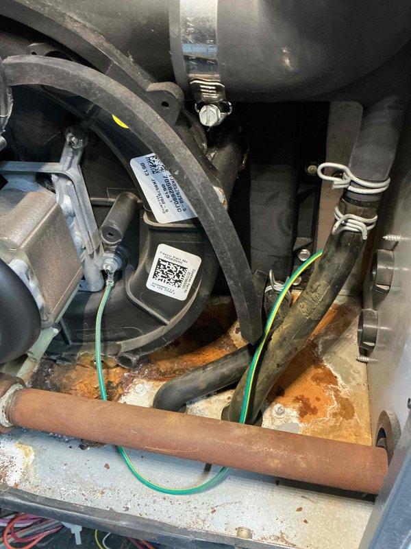 Responded to no-heat call on nine-year-old furnace with complete ignition failure. Upon inspection, discovered significant rust and corrosion on internal piping and mechanical components, indicating moisture intrusion issues. The oxidation was particularly severe on horizontal tubing and metal surfaces where components meet, compromising system integrity. Performed diagnostic testing to identify ignition system failure points and assessed extent of corrosion damage throughout the unit. Documented equipment condition with detailed photographs showing rust patterns, corroded piping, and general wear on mechanical assemblies. Evaluated electrical connections, gas supply components, and control systems to determine root cause of ignition failure. Unit showed evidence of prolonged moisture exposure affecting multiple metal components within the cabinet. Provided comprehensive assessment of necessary repairs to restore proper operation and prevent future moisture-related failures.