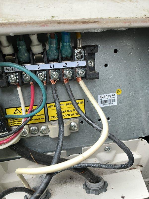 Completed cooling maintenance inspection on multi-unit HVAC system with four outdoor condensing units. Inspected electrical disconnect boxes and fuse assemblies, documenting condition of Edison-type ECNR25 fuses, terminal connections, and associated wiring at each unit location. All electrical components, terminal blocks, and safety disconnect switches were verified for proper operation and secure connections.