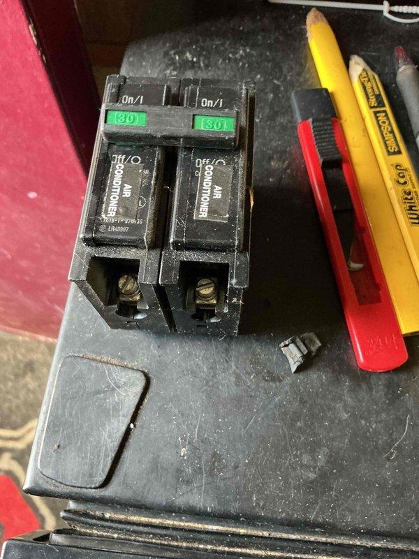 Responded to no cooling call and performed diagnostic evaluation. Upon inspection, discovered a failed 40-amp circuit breaker serving the air conditioning system with severe heat damage, melted housing, and charred internal components. The breaker had experienced catastrophic failure, preventing power from reaching the AC unit. Replaced the damaged breaker with new 40-amp breaker rated for air conditioning load. Verified proper electrical connections, tested voltage at panel, and confirmed system operation. Unit now cooling properly with all electrical components functioning within normal parameters.