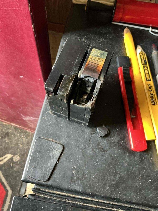 Responded to no cooling call and performed diagnostic evaluation. Upon inspection, discovered a failed 40-amp circuit breaker serving the air conditioning system with severe heat damage, melted housing, and charred internal components. The breaker had experienced catastrophic failure, preventing power from reaching the AC unit. Replaced the damaged breaker with new 40-amp breaker rated for air conditioning load. Verified proper electrical connections, tested voltage at panel, and confirmed system operation. Unit now cooling properly with all electrical components functioning within normal parameters.