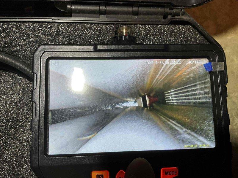 Completed preventive maintenance tune-up on a 5-year-old air conditioning system located in the basement. Performed comprehensive inspection using borescope camera equipment to examine internal ductwork condition and evaporator coil fins, confirming proper cleanliness and structural integrity of all accessible components.