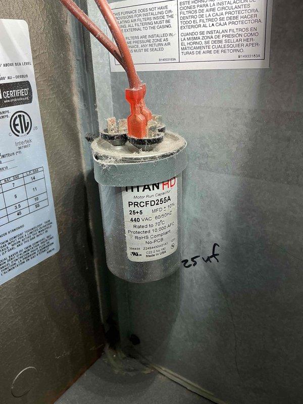 Completed MVP heating maintenance on 2-year-old Amana Distinctions furnace located in tight utility closet off kitchen. Performed comprehensive system inspection, verified proper operation of all components including TITAN HD dual capacitor (25+5 MFD, 440 VAC), checked electrical connections, inspected heat exchanger, tested ignition system, and verified proper airflow through ductwork. All equipment found operating within manufacturer specifications with no issues identified.