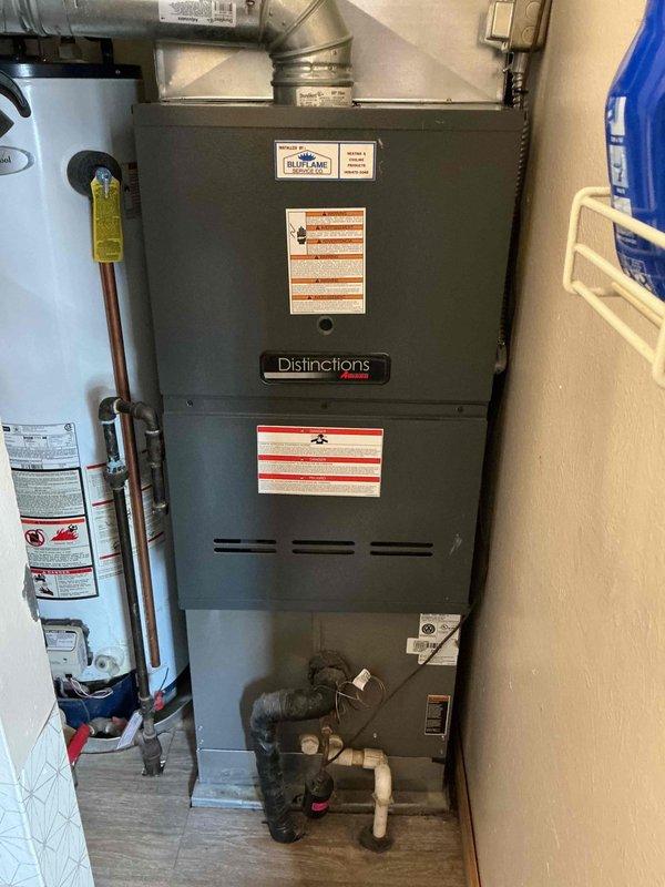 Completed MVP heating maintenance on 2-year-old Amana Distinctions furnace located in tight utility closet off kitchen. Performed comprehensive system inspection, verified proper operation of all components including TITAN HD dual capacitor (25+5 MFD, 440 VAC), checked electrical connections, inspected heat exchanger, tested ignition system, and verified proper airflow through ductwork. All equipment found operating within manufacturer specifications with no issues identified.