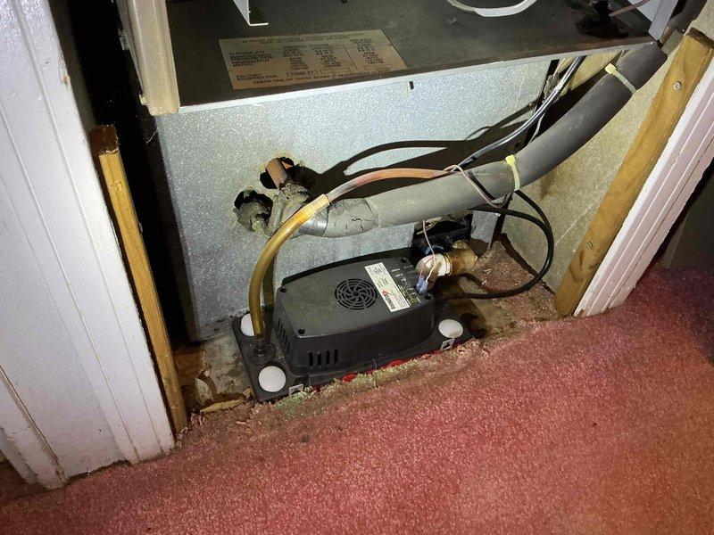 Performed comprehensive cooling system tune-up on residential air conditioning system, including both indoor air handler unit located in interior closet space and outdoor condensing unit. Inspected all electrical connections, refrigerant lines, and system components; verified proper operation of both units and documented system condition with photographs for service records.
