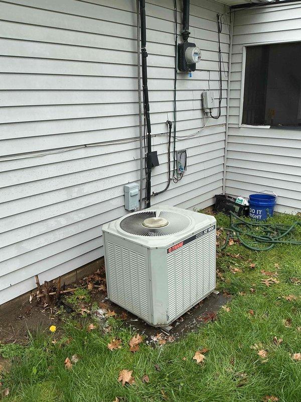 Performed comprehensive cooling system tune-up on residential air conditioning system, including both indoor air handler unit located in interior closet space and outdoor condensing unit. Inspected all electrical connections, refrigerant lines, and system components; verified proper operation of both units and documented system condition with photographs for service records.