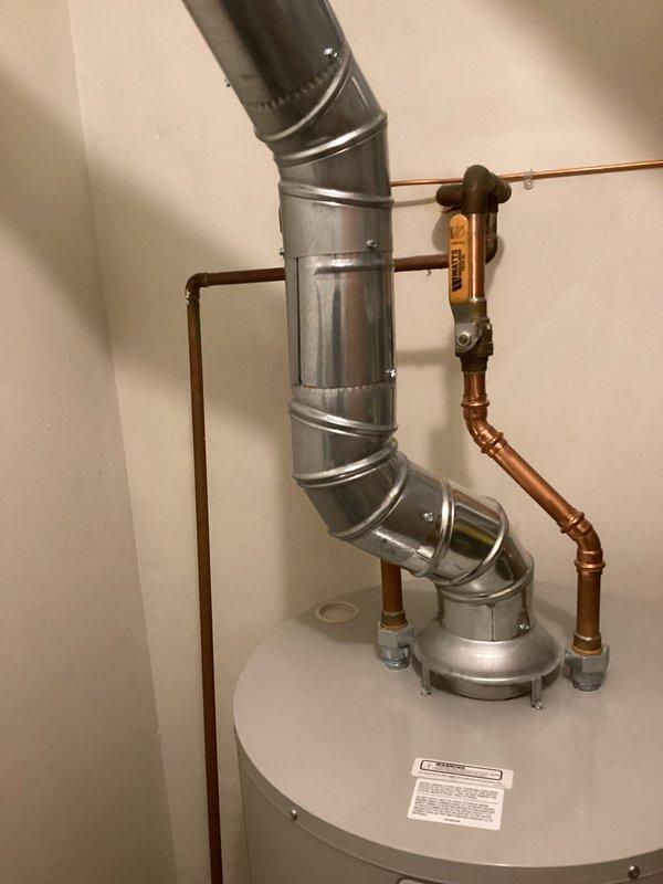 Responded to pre-sale home inspection concerns regarding plumbing installations. Inspected and addressed flue vent configuration on water heater to ensure compliance with code requirements and provided technical documentation explaining proper installation methodology. Installed sediment trap (drip leg) on gas line serving dryer appliance to meet current safety standards and inspection requirements for property transfer.