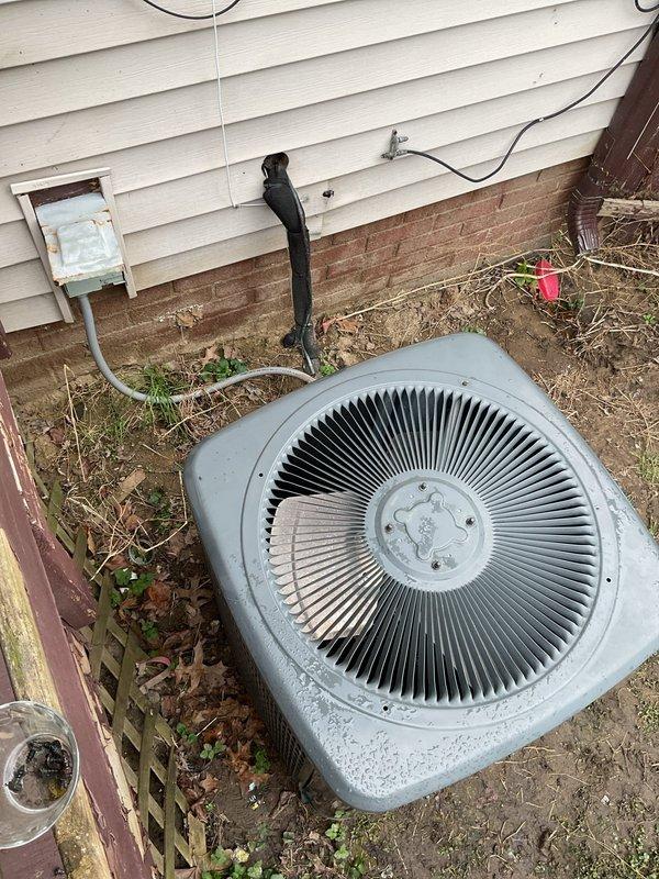 Conducted comprehensive site evaluation for replacement of existing 2.5 ton air conditioning system. Assessed current indoor furnace unit located in basement utility area, noting existing ductwork configuration with multiple supply runs and PVC condensate drainage lines. Evaluated outdoor condenser unit positioned against exterior wall, observing weathered condition and deteriorated performance characteristics. Documented equipment specifications, electrical connections, refrigerant line routing through exterior wall, and clearance requirements for new installation. Provided detailed estimate for complete system replacement including removal of existing equipment and installation of new 2.5 ton air conditioning system.