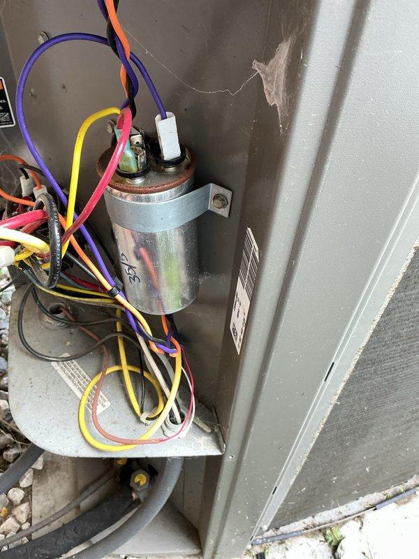 Completed scheduled preventive maintenance on residential air conditioning system as part of recurring maintenance program. Performed comprehensive inspection of outdoor condensing unit, including examination of electrical components, capacitor, and wiring connections. Verified all wire terminations were secure at contactor and capacitor terminals. Inspected dual-run capacitor condition and mounting bracket integrity. Checked electrical connections for proper color coding and secure fastening at terminal blocks. Noted normal operational wear and minor dust accumulation on internal components consistent with system age. All electrical components functioning within normal parameters. Unit operational and cooling properly upon completion of maintenance visit.