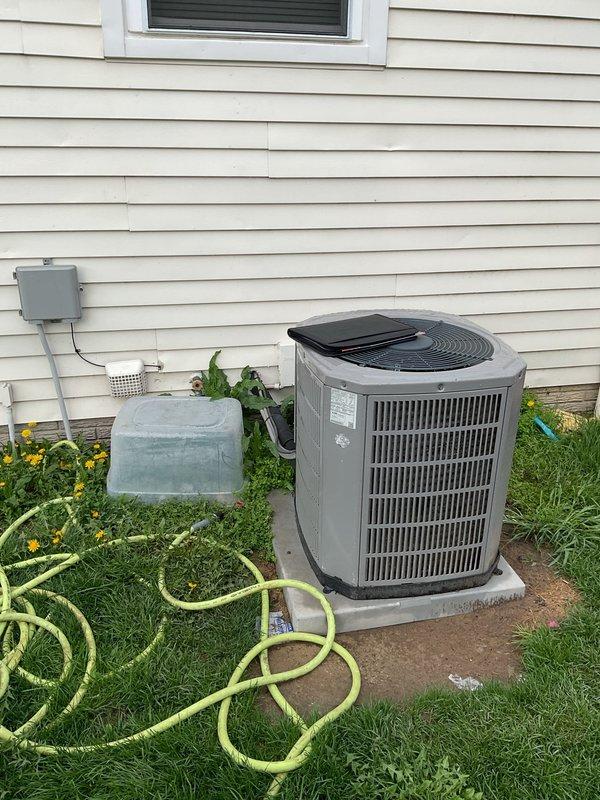 Provided estimate for complete air conditioning system replacement including outdoor condensing unit and indoor furnace/air handler, along with thermostat upgrade. Assessed existing equipment located at exterior side of residence and basement utility area, documented current system configuration, and prepared comprehensive replacement proposal for customer consideration.