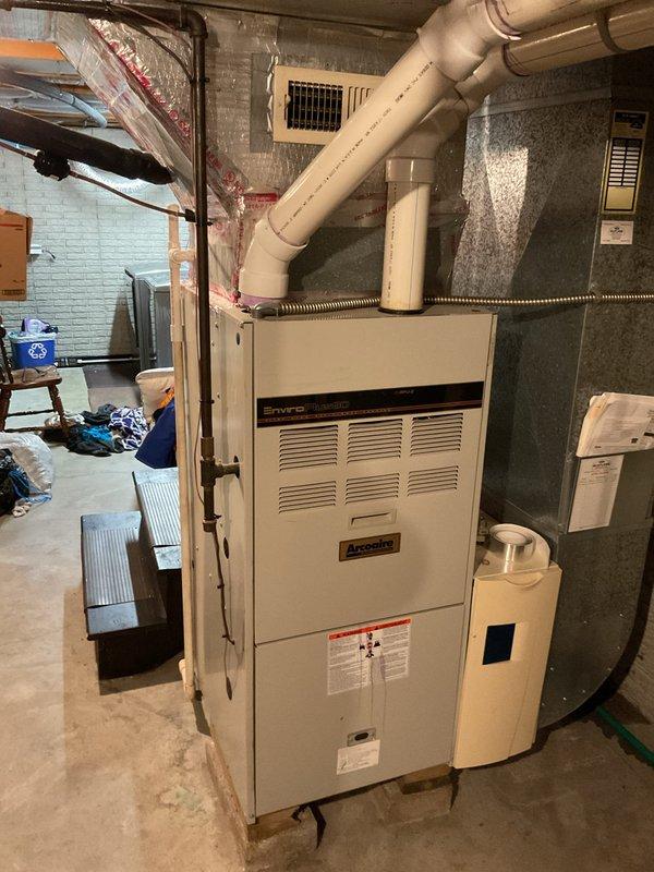 Provided estimate for complete air conditioning system replacement including outdoor condensing unit and indoor furnace/air handler, along with thermostat upgrade. Assessed existing equipment located at exterior side of residence and basement utility area, documented current system configuration, and prepared comprehensive replacement proposal for customer consideration.