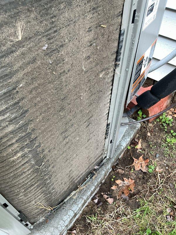 # HVAC Maintenance - Cooling

Performed routine maintenance inspection on a 4-year-old residential air conditioning system. Accessed outdoor condensing unit, removed top panel to inspect internal components including condenser coils, refrigerant lines, and electrical connections. Both heat exchanger coils showed normal operational condition with typical accumulation of outdoor debris around unit base. Verified copper refrigerant lines and electrical wiring connections were secure and functioning properly. Unit exterior showed normal weathering consistent with age and outdoor exposure. All components appeared operational with no immediate repairs required at time of service.