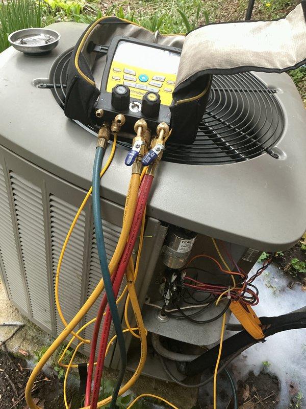 Completed HVAC maintenance service on residential cooling system. Performed diagnostic testing using refrigerant manifold gauges to check system pressures and verify proper refrigerant charge. Inspected electrical components including contactor and capacitor, verified all wire connections secure, and confirmed proper operation of outdoor condensing unit. System operating within normal parameters upon completion of maintenance visit.