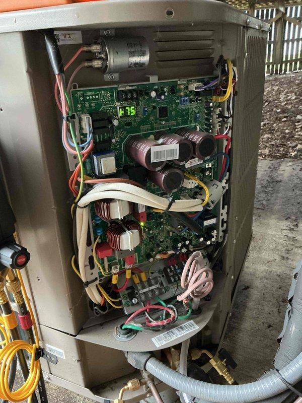 Completed spring maintenance on two cooling systems: a 6-year-old central air conditioning unit and a 15-year-old mini-split system. Upon arrival, performed comprehensive inspection of both units including electrical components, refrigerant lines, and control boards. The central AC unit showed significant refrigerant leak evidenced by white foamy substance accumulation on the concrete pad beneath the condenser. Opened cabinet to access internal components, inspected circuit boards, capacitor, transformer coils, and wiring connections. Checked digital display functionality and verified all electrical connections were secure. Examined copper refrigerant lines and service ports for additional leak points. Assessed blower motor assembly and ventilation system. Documented unit condition with photos showing internal PCB configuration, color-coded wiring, and the refrigerant leak issue requiring immediate attention. The mini-split system was also inspected as part of the scheduled maintenance