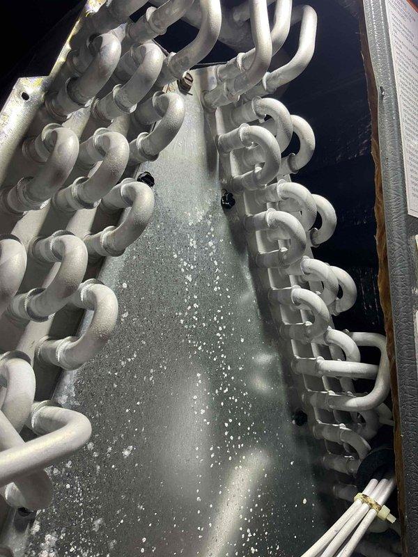 Completed routine air conditioning maintenance visit for MVP customer. Performed comprehensive system inspection including evaporator coil examination, verified proper condensation drainage, and documented equipment condition with photographic records. All components found operating within normal parameters with no immediate service needs identified.