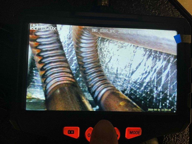 Completed comprehensive cooling maintenance on 10-year-old AC system. Performed detailed inspection of evaporator coil using endoscope camera, revealing significant dust and debris accumulation on aluminum fins and evidence of corrosion on refrigerant lines. Documented condition with inspection photos showing dirty coil surfaces requiring cleaning and rust formation on copper tubing connections. Cleaned evaporator coil, removed debris buildup from fins, checked refrigerant line integrity, and verified system operation within normal parameters.
