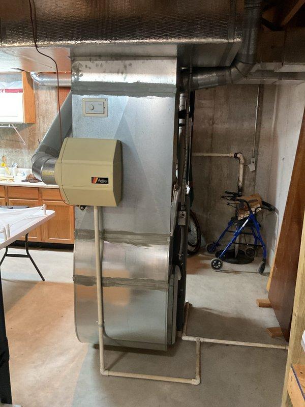 Conducted comprehensive estimate for complete air conditioning system replacement at residential property. Evaluated existing HVAC infrastructure in basement mechanical room, including current furnace installation, ductwork configuration, humidifier system, and electrical service capacity at main breaker panel. Documented equipment specifications, assessed ductwork compatibility for new AC unit integration, verified electrical panel capacity for air conditioner circuit requirements, and photographed existing system components to develop accurate replacement proposal.