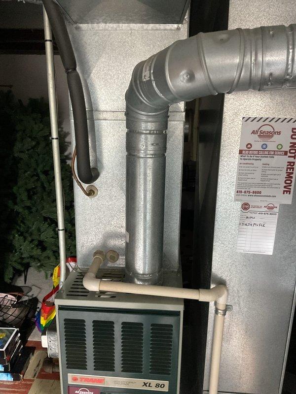 Provided comprehensive estimate for replacement of existing 2-ton air conditioning system. Evaluated current Trane XE 1000 outdoor condenser unit and indoor Trane XL 80 air handler with associated ductwork and refrigerant lines. Documented existing equipment specifications, installation configuration, and system layout including flexible duct connections, PVC condensate drainage, and electrical disconnects to prepare detailed replacement proposal for customer consideration.