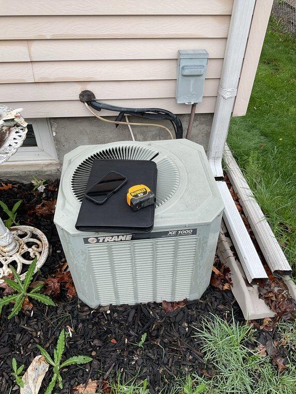 Provided comprehensive estimate for replacement of existing 2-ton air conditioning system. Evaluated current Trane XE 1000 outdoor condenser unit and indoor Trane XL 80 air handler with associated ductwork and refrigerant lines. Documented existing equipment specifications, installation configuration, and system layout including flexible duct connections, PVC condensate drainage, and electrical disconnects to prepare detailed replacement proposal for customer consideration.
