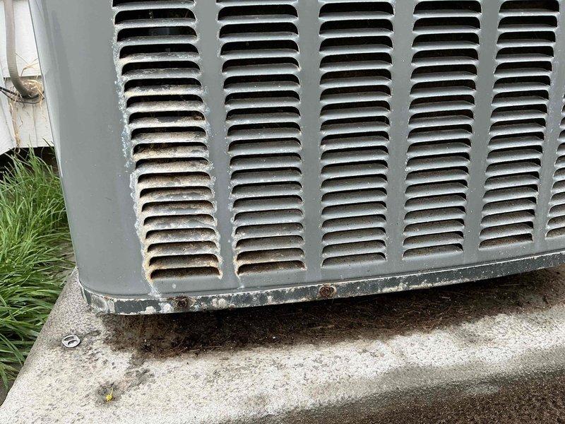 Responded to no-cooling complaint on a 5-year-old air conditioning system at a commercial property. Upon arrival, connected diagnostic equipment to the outdoor condensing unit and performed system evaluation. Found unit non-operational with visible corrosion at base and weathering on exterior components. Tested electrical connections at disconnect box, checked refrigerant pressures at service ports using manifold gauges, and diagnosed system failure preventing compressor operation.