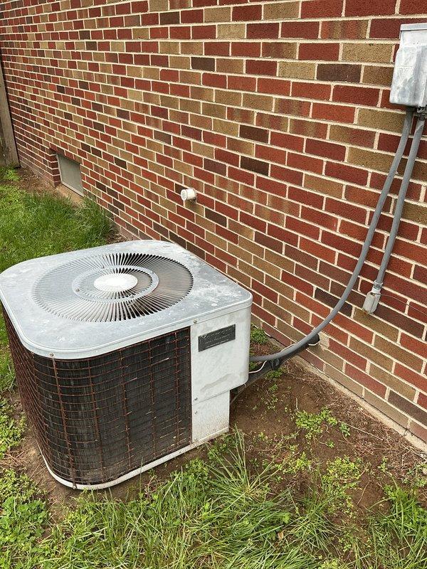 Responded to no-cooling complaint on residential air conditioning system over 10 years old. Upon arrival, diagnosed condenser fan motor failure preventing compressor operation. Verified system electrical connections at outdoor disconnect and tested indoor airflow at supply register to confirm blower operation. Replaced failed condenser fan motor and restored unit to normal operation with proper cooling functionality.