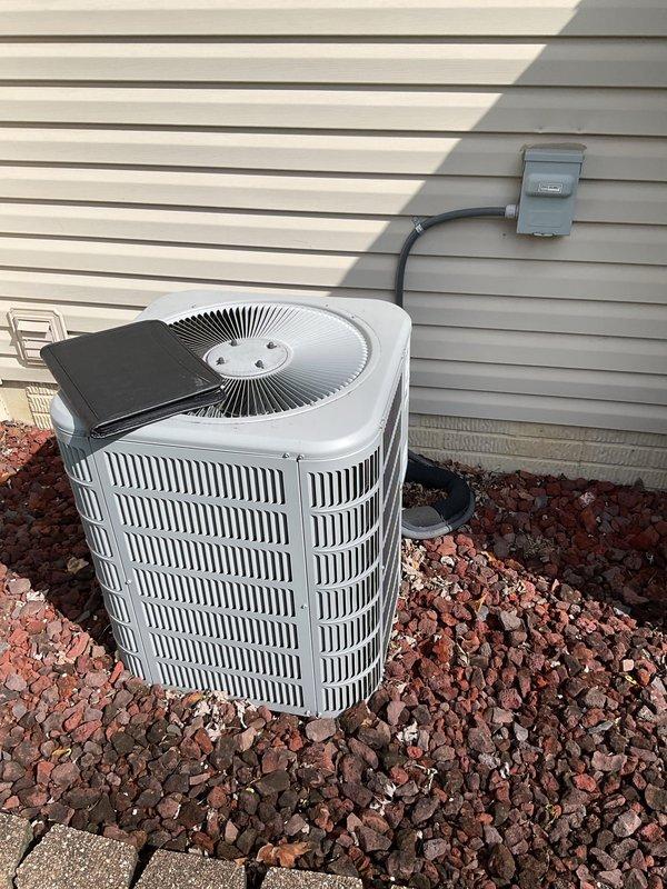 Completed comprehensive assessment of existing residential HVAC system for full replacement estimate. Evaluated outdoor Concord air conditioning condenser unit positioned on exterior wall with lava rock landscaping and proper electrical connection via weatherproof disconnect box. Inspected indoor Concord furnace installation in basement utility area, including integrated bypass humidifier, PVC condensate drainage and venting system, and metallic flex duct connections. Documented current equipment conditions, specifications, and installation configuration through detailed photographic documentation to provide accurate replacement proposal for complete heating and cooling system upgrade.