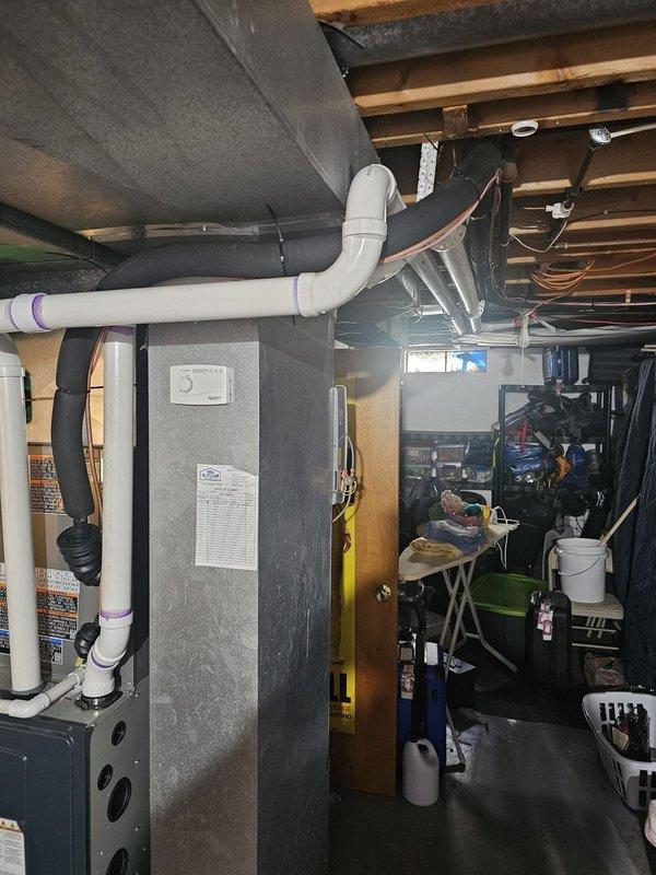 Completed installation of a 14 SEER 2.5 ton air conditioning system with matching upflow cased coil in basement location. Installed new 3/4" x 30' refrigerant lineset connecting outdoor condensing unit to indoor coil, mounted outdoor unit on new 3' equipment pad, and wired system with new disconnect and whip for proper electrical service. Integrated Honeywell Wi-Fi thermostat for remote temperature control and system monitoring. All components tested and verified operational upon completion.