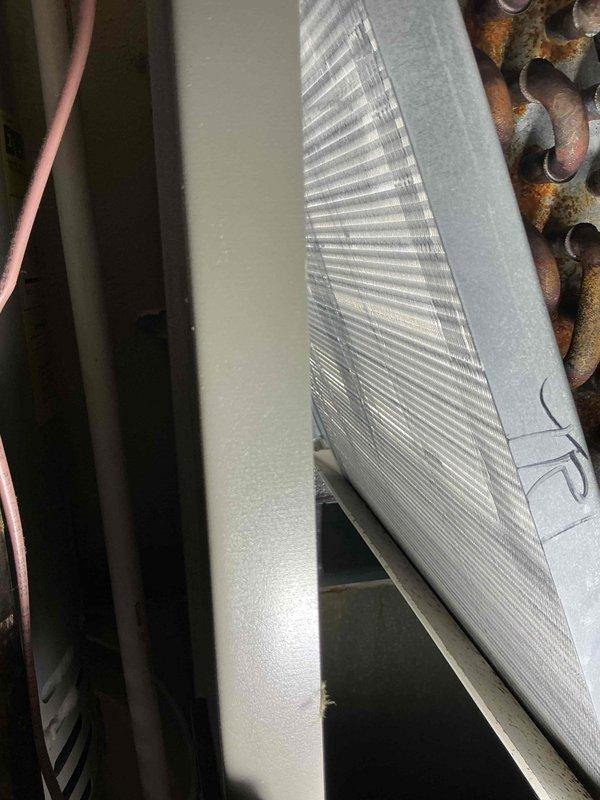 Performed comprehensive heating and cooling system tune-up on 4-year-old gas furnace unit. Inspected evaporator coil assembly and heat exchanger components, noting clean aluminum fins in satisfactory condition. Observed moderate to significant oxidation and corrosion on copper refrigerant tubing, which is typical for equipment age but will require monitoring for potential future service needs.