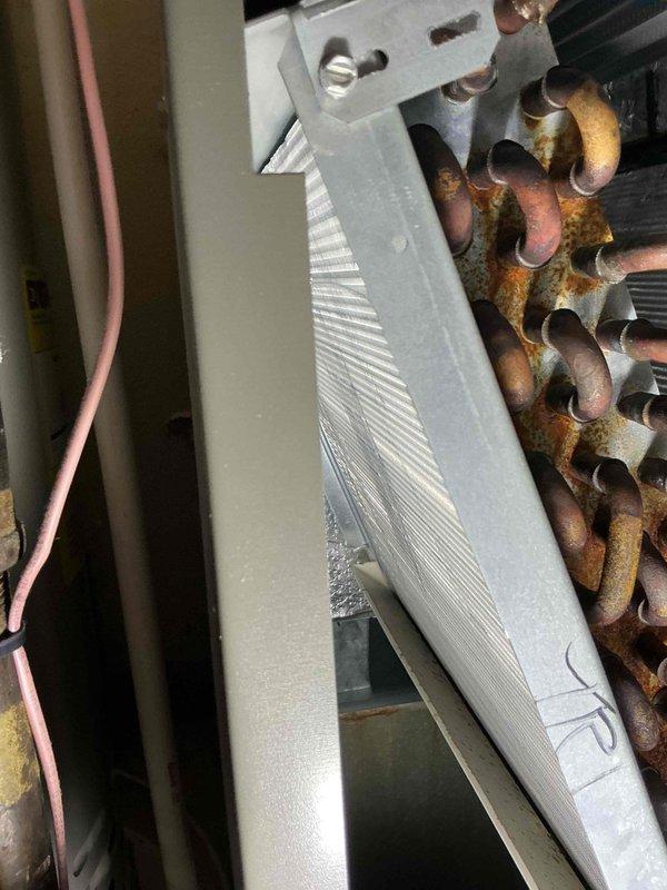 Performed comprehensive heating and cooling system tune-up on 4-year-old gas furnace unit. Inspected evaporator coil assembly and heat exchanger components, noting clean aluminum fins in satisfactory condition. Observed moderate to significant oxidation and corrosion on copper refrigerant tubing, which is typical for equipment age but will require monitoring for potential future service needs.