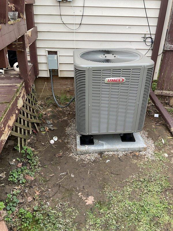 Completed installation of a 14 SEER 2.5 ton Lennox packaged air conditioning unit with matching evaporator coil. Installed new 3/4" copper lineset with 20 feet of refrigerant piping, mounted unit on new concrete pad with 6" pump-up risers for proper drainage and elevation. Ran new electrical whip and disconnect box to meet code requirements. System commissioned and tested for proper operation with all refrigerant pressures and airflow verified within manufacturer specifications.