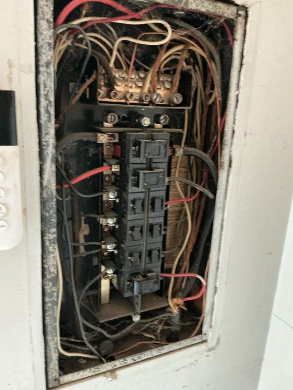 Responded to no cooling call and performed diagnostic evaluation of air conditioning system. Upon inspection, accessed electrical panel and HVAC control components to assess system functionality. Examined electrical contactors, relays, and associated wiring connections within the unit. Documented existing conditions including dust accumulation on electrical components and mounting brackets. Verified circuit breaker panel connections and traced power supply to cooling equipment to identify potential causes of system failure.