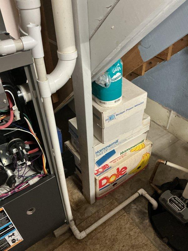 # HVAC Cooling System Maintenance

Performed comprehensive preventive maintenance on a 3-year-old residential air conditioning system. Conducted thorough inspection of outdoor condenser unit, noting weathering and discoloration on exterior casing panels with visible streaking and staining consistent with normal environmental exposure. Examined condenser coil assembly and copper refrigerant lines for proper condition and integrity.

Accessed indoor air handler equipment in basement utility area to complete system evaluation. Inspected electrical connections, wiring, and control components within air handler cabinet. Verified proper operation of condensate drain system, including PVC drain line routing and functionality to prevent water damage and ensure adequate moisture removal.

Cleaned condenser coils to remove accumulated debris and maintain optimal heat transfer efficiency. Checked refrigerant line insulation and connections for signs of wear or damage. Tested system operation thro