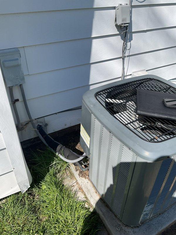 Completed residential HVAC system estimate for complete replacement of existing heating and cooling equipment. Assessed current furnace installation in basement utility area and outdoor air conditioning condenser unit, documenting existing gas line connections, electrical disconnect, PVC venting configuration, and ductwork arrangement for proper equipment sizing and replacement planning.
