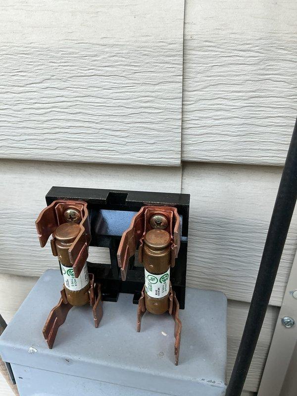 Completed scheduled MVP cooling maintenance visit. Accessed air handler unit located in attic using ladder. Performed comprehensive system inspection including electrical disconnect and fuse assembly verification. All components found in proper working condition with copper terminals and fuse holders showing normal operation. System tested and confirmed operating within manufacturer specifications.