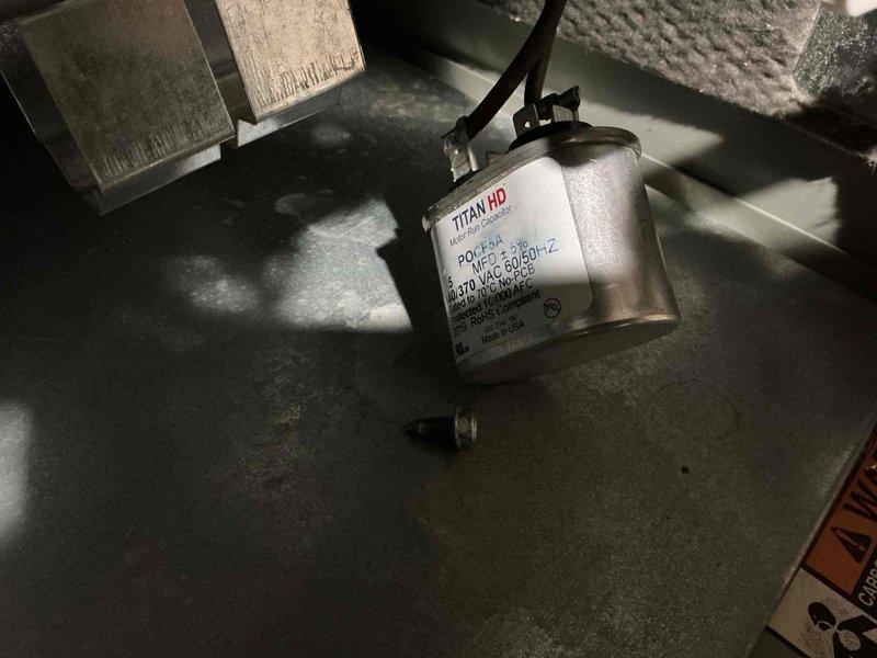 Completed scheduled cooling maintenance on 18-year-old HVAC system. Performed comprehensive inspection of outdoor condensing unit, identifying heavily corroded dual-run capacitor requiring monitoring. Replaced TITAN HD power capacitor (MVC 50/50-IZ, 370 VAC) to ensure reliable compressor and fan motor operation. Cleaned accumulated debris from unit interior, tested all electrical connections, and verified proper system operation. Customer also requested furnace maintenance to be performed in conjunction with cooling service.