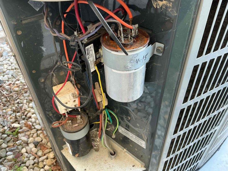 Completed scheduled cooling maintenance on 18-year-old HVAC system. Performed comprehensive inspection of outdoor condensing unit, identifying heavily corroded dual-run capacitor requiring monitoring. Replaced TITAN HD power capacitor (MVC 50/50-IZ, 370 VAC) to ensure reliable compressor and fan motor operation. Cleaned accumulated debris from unit interior, tested all electrical connections, and verified proper system operation. Customer also requested furnace maintenance to be performed in conjunction with cooling service.