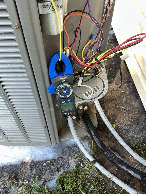 Performed scheduled maintenance on a 20-year-old residential air conditioning system. Conducted comprehensive electrical diagnostics using multimeter to test capacitor functionality (30/5 MFD, 440V rated) and verified proper voltage and amperage across all electrical components. Inspected condenser coil fins, which showed adequate moisture indicating active refrigerant cycle operation, and confirmed unit structural integrity with minimal debris accumulation on outdoor equipment.