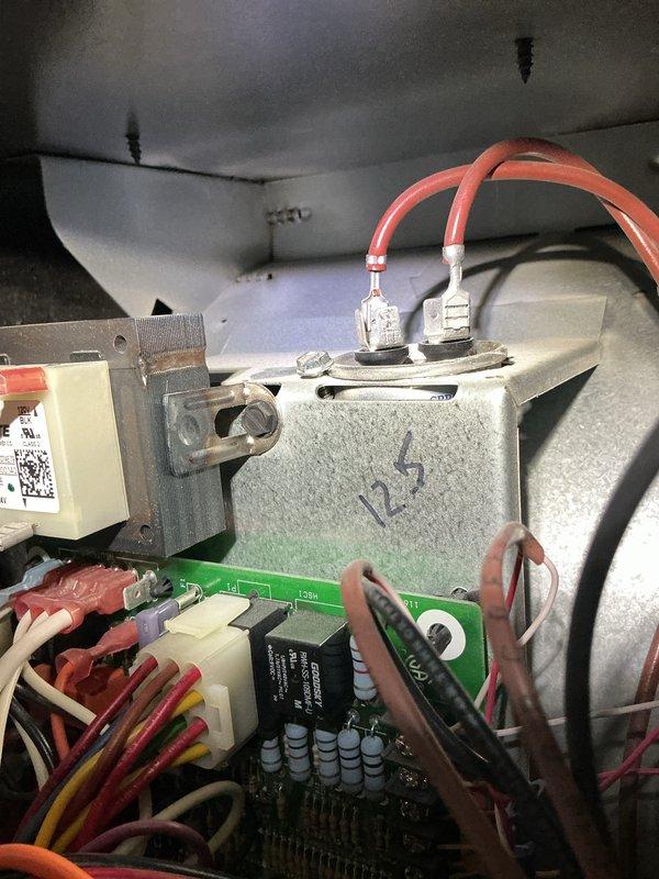 Completed recurring cooling maintenance on 11-year-old system. Performed diagnostic measurements using digital testing equipment, recording temperature readings of 538°F at specified test point. Inspected and documented internal electrical components including control board, wiring harness connections, and relay assembly to verify proper operation and system integrity for continued reliable cooling performance.