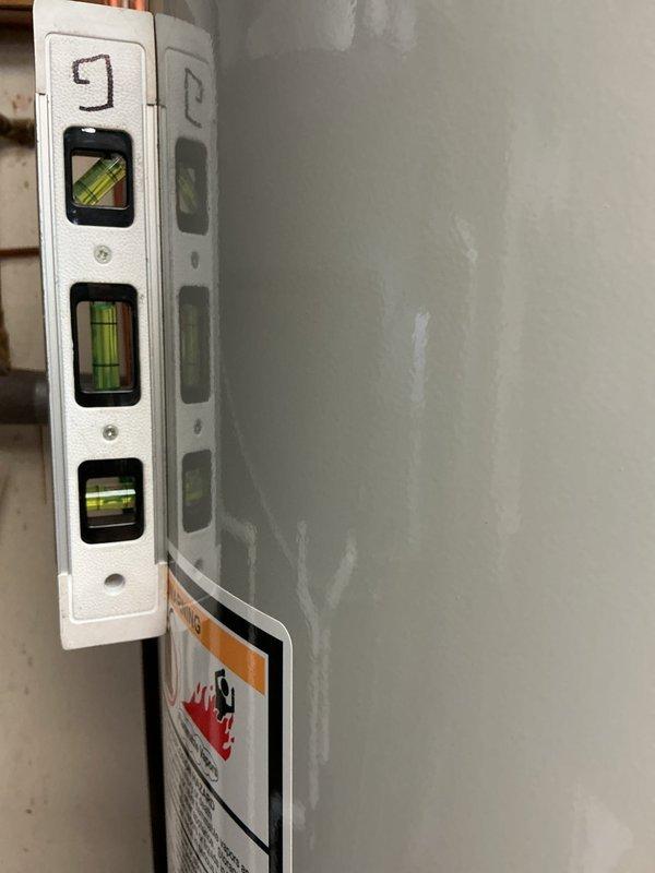 Completed installation of 40-gallon short tank water heater as part of a previously scheduled full system installation. Connected copper supply lines with proper fittings and verified level installation in mechanical room alongside existing HVAC equipment and ductwork.