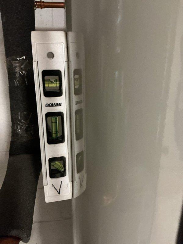 Reconnected tanked water heater with proper plumbing connections and venting. All copper supply lines, shut-off valves, and flue pipe were secured and verified for level installation. System tested and confirmed operational.